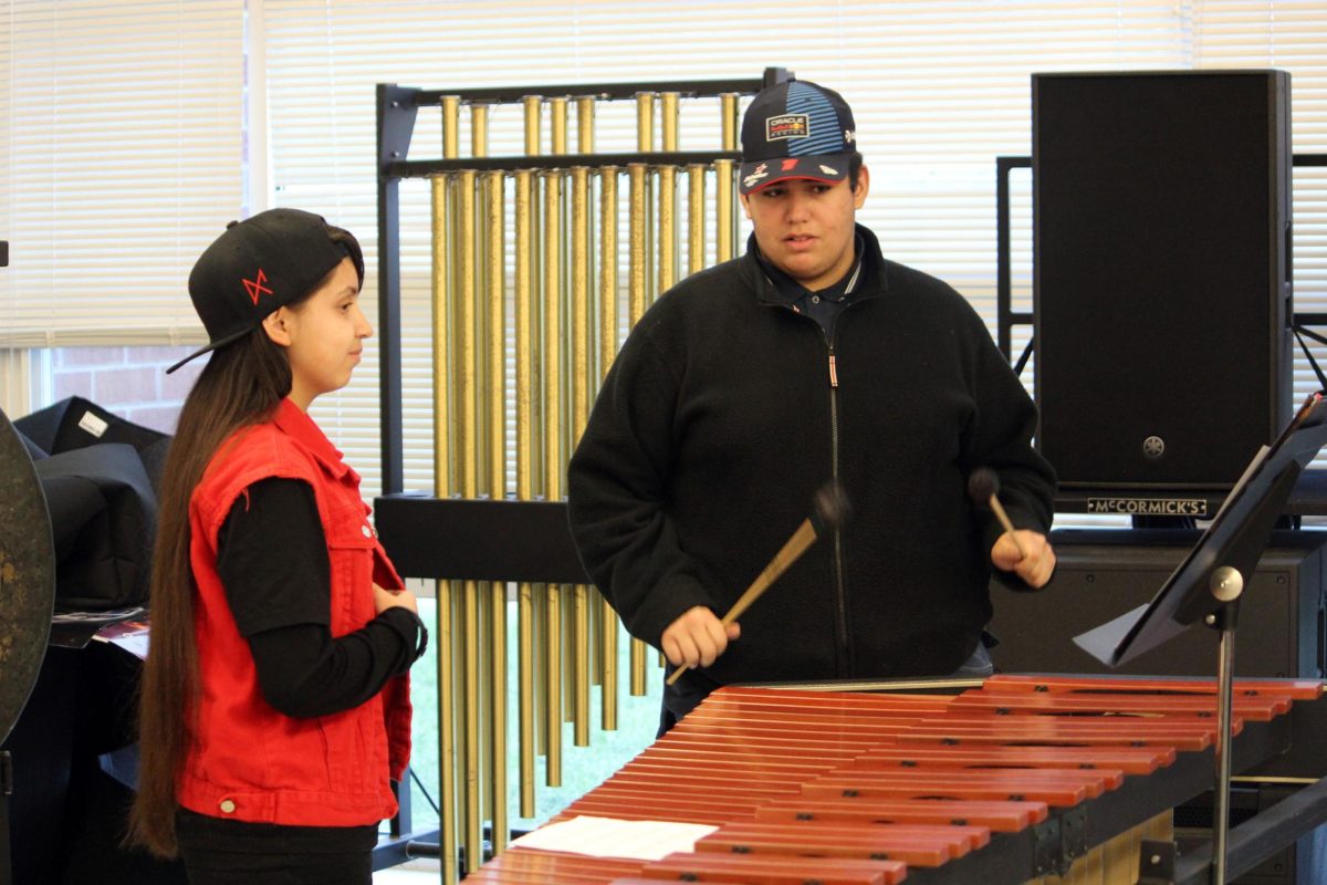 Students work together to learn the new arrangement.
