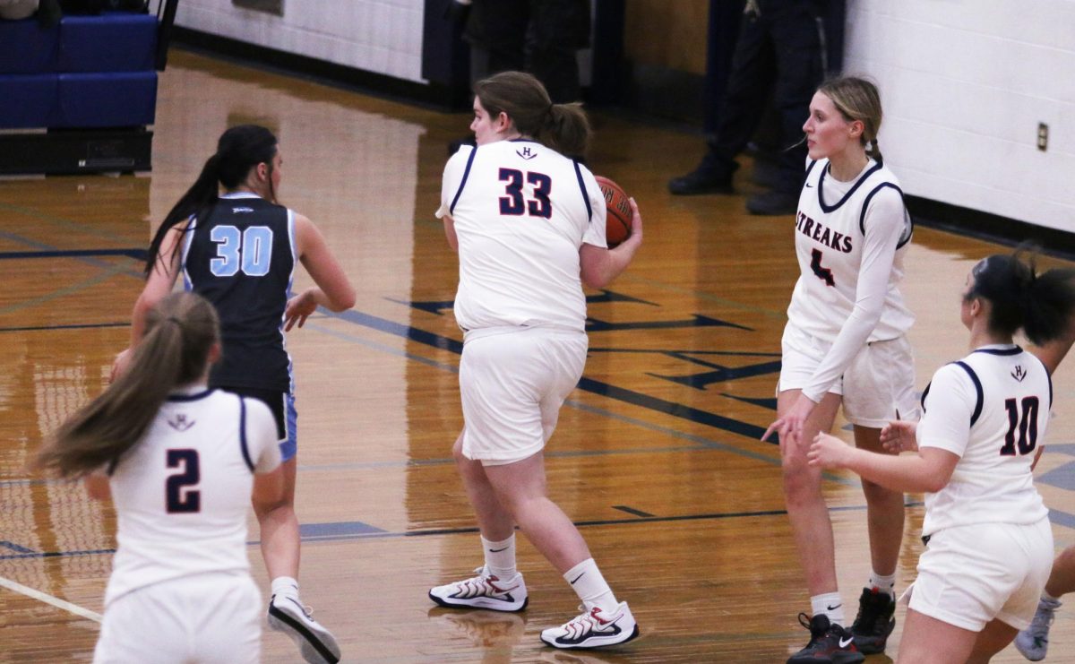 Lily Rupe guards the ball from a Page County player