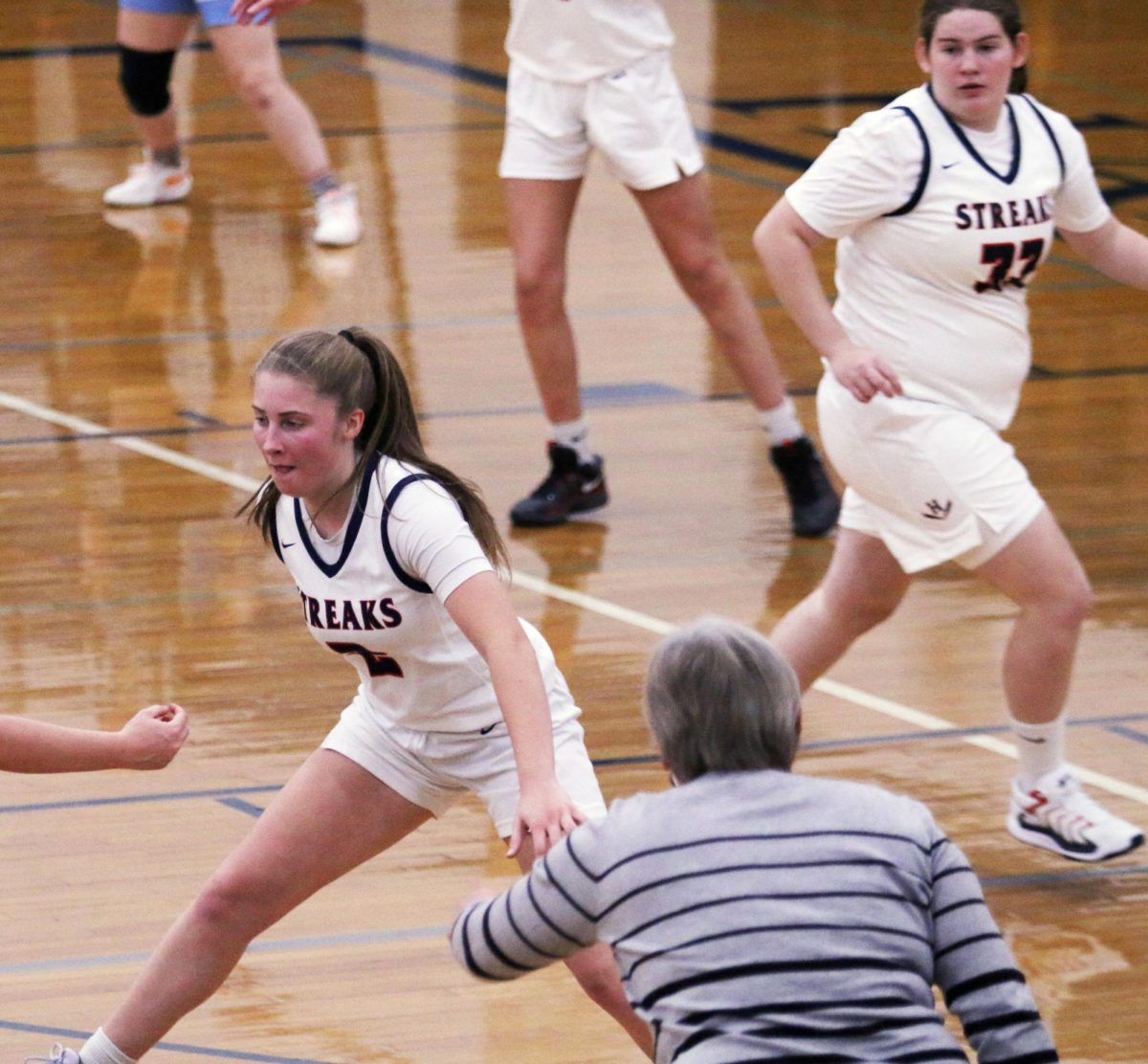 Coach, Tracy Harding directes players on what to do