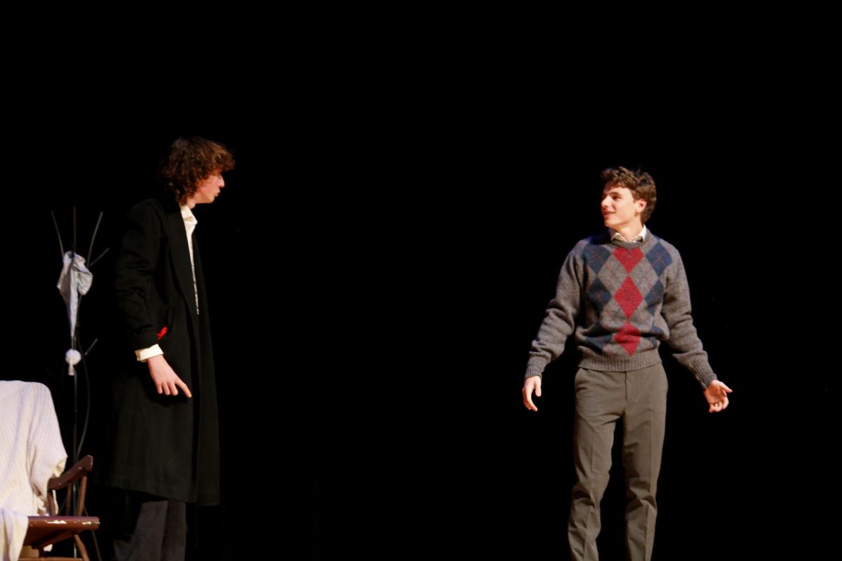 Scrooge's nephew, Fred (Louis Gibson) visits Scrooge to invite him to a christmas party at his home. Scrooge (Ell Norment) turns him down.