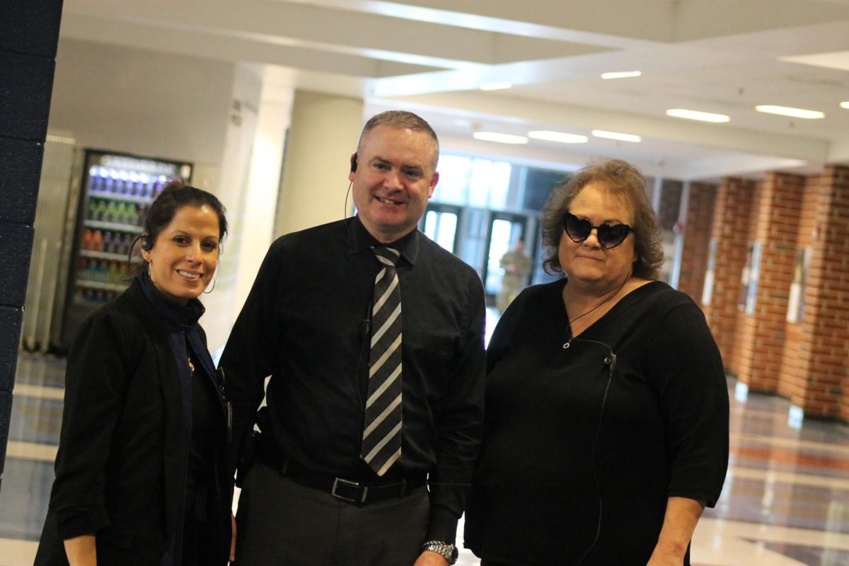 Ms. Hart, Mr. Johnston and Ms. Frongia posing with their spy outfits.