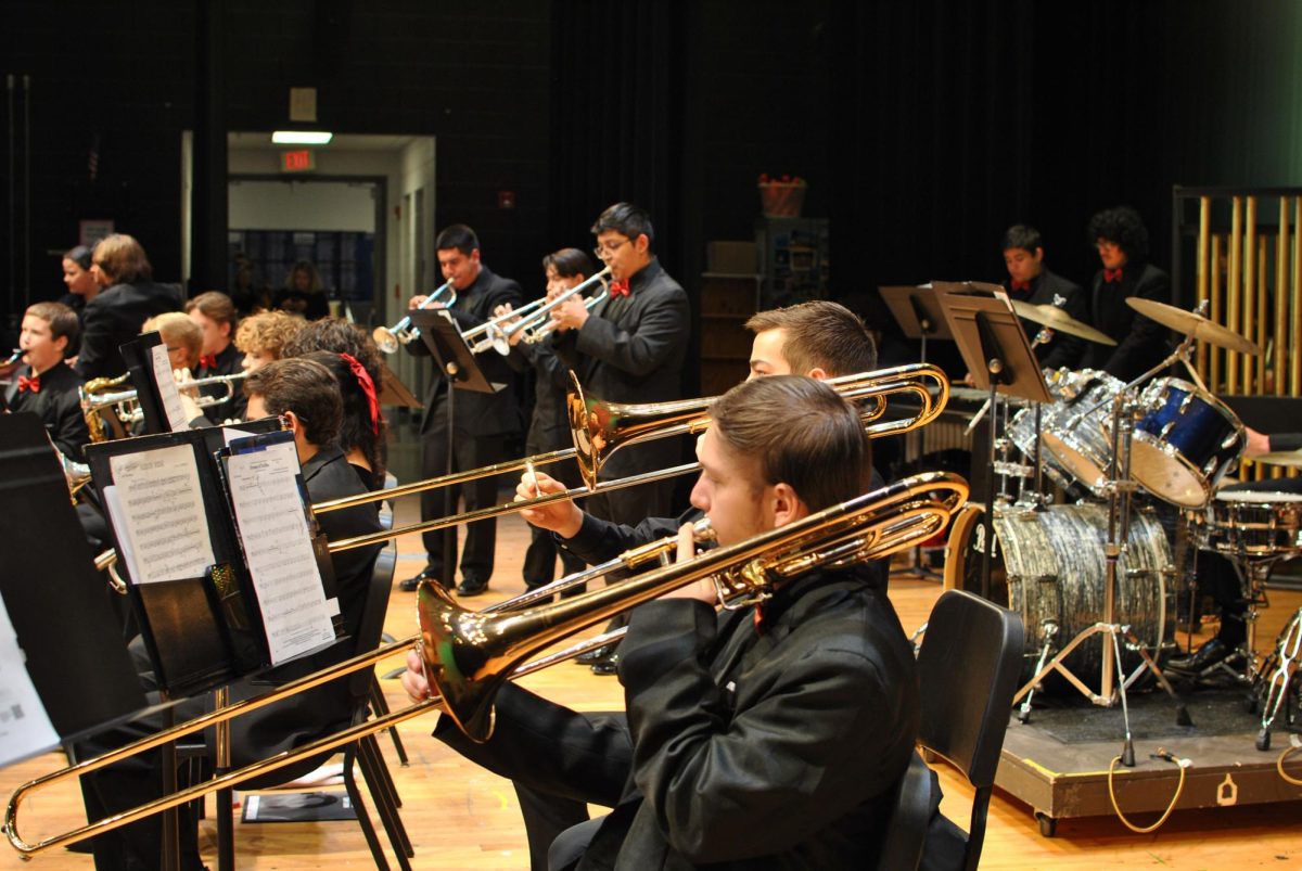 Trombone section of the band performing.