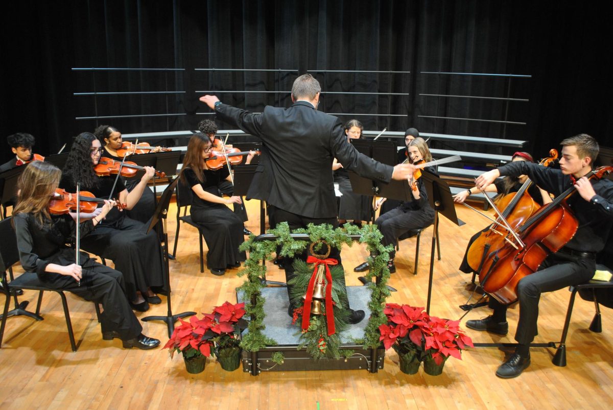 Close up of Mr. Inchek directing his students.