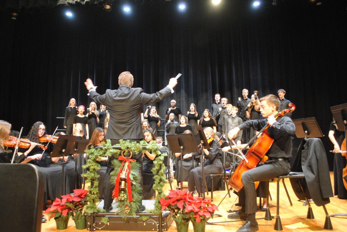 Mr inchek doing the iron man pose to direct his orchestra.