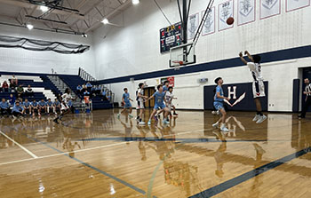 Pierre Ngeleka shooting a three.