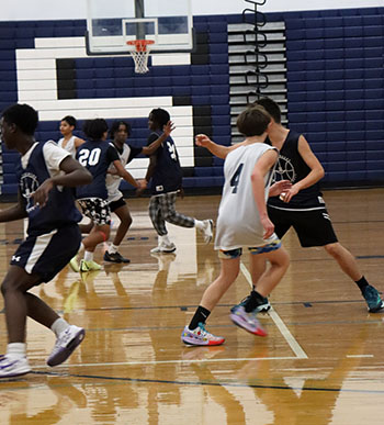 team running down the court