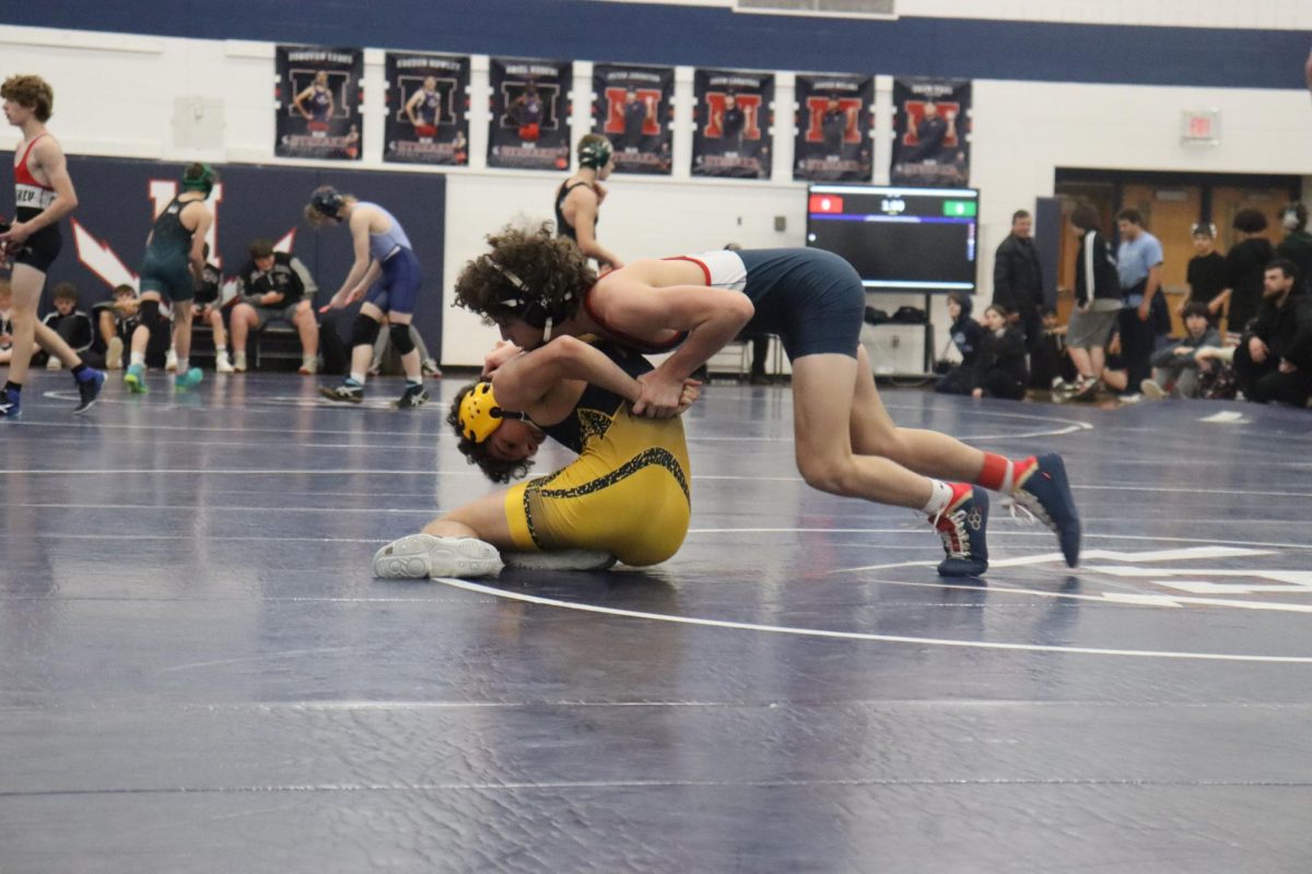 Mason George pinning his opponent. 