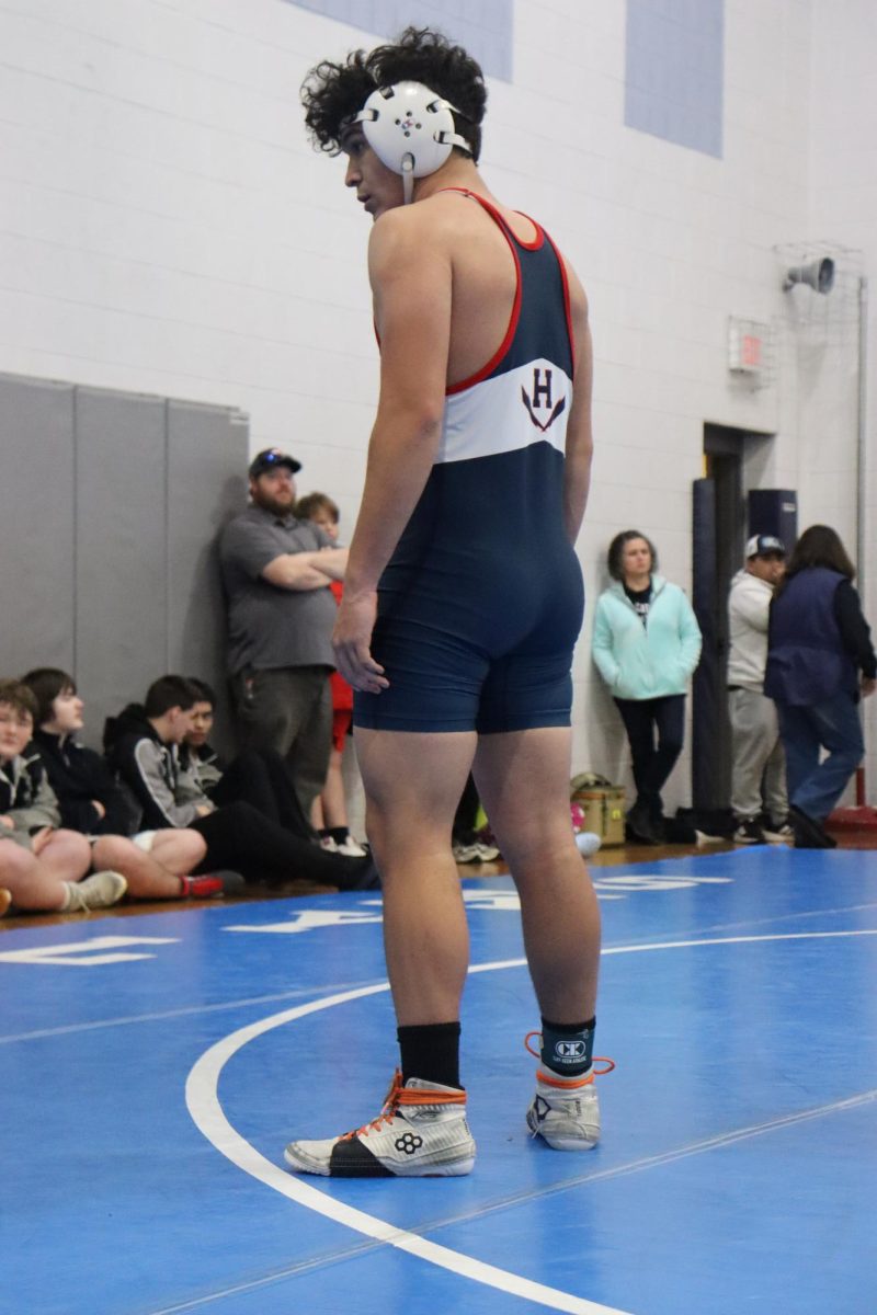 Armando Hernandez Erazo listening to his coach give him tips for his match.