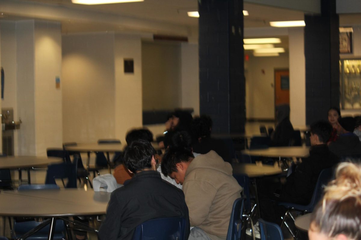 The cafeteria was filled with students, their friends, and parents who observed the presentation in front of them. Apart from some parents who appeared at the meeting, it differed from some who didn't! And that was just fine, students did tend to hang out with their friends which gave the meeting excitement.