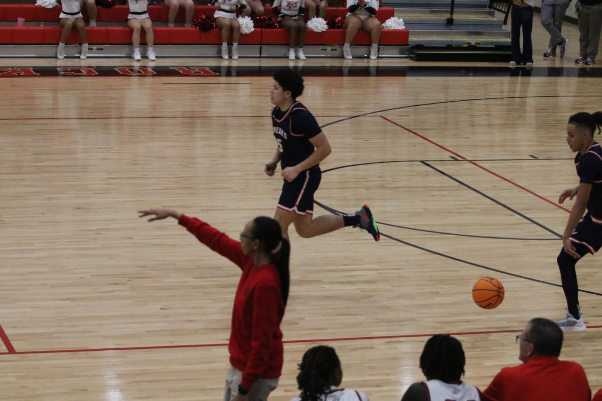 Sophomore Yandel Roberts running to defend the ball