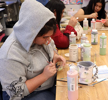 Anilliana Hernandez works on her "ugly mug" project.