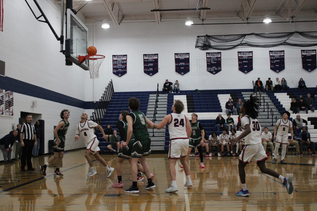 The Harrisonburg High School basketball team competes against William Monroe High School basketball team. The HHS basketball team plays strong and focuses on making as many shots as possible.
