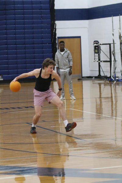 Louis Gibson rolls the ball to opposing team