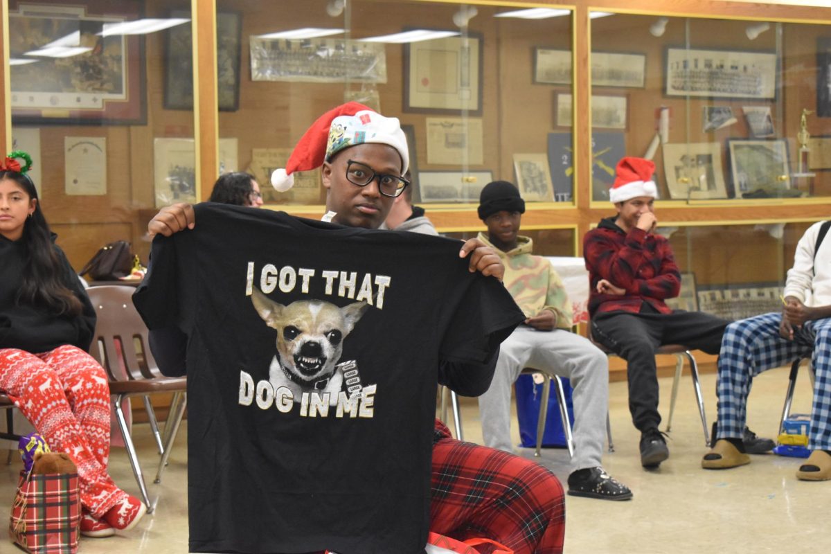Senior Aron Medhin loves his new shirt that was a gift 
