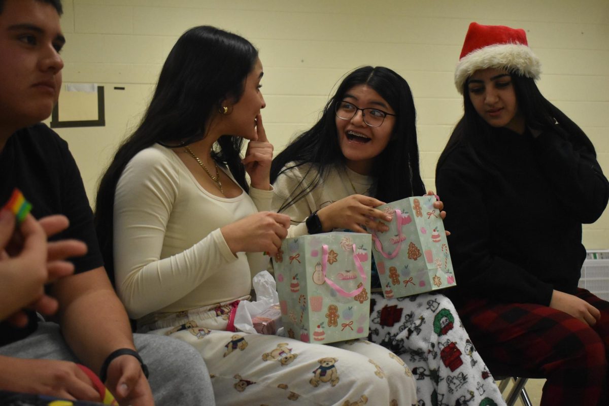 Sophomore Estefany Ortega and Elizabeth Santiago  both surprised about their gift from the secret Santa.