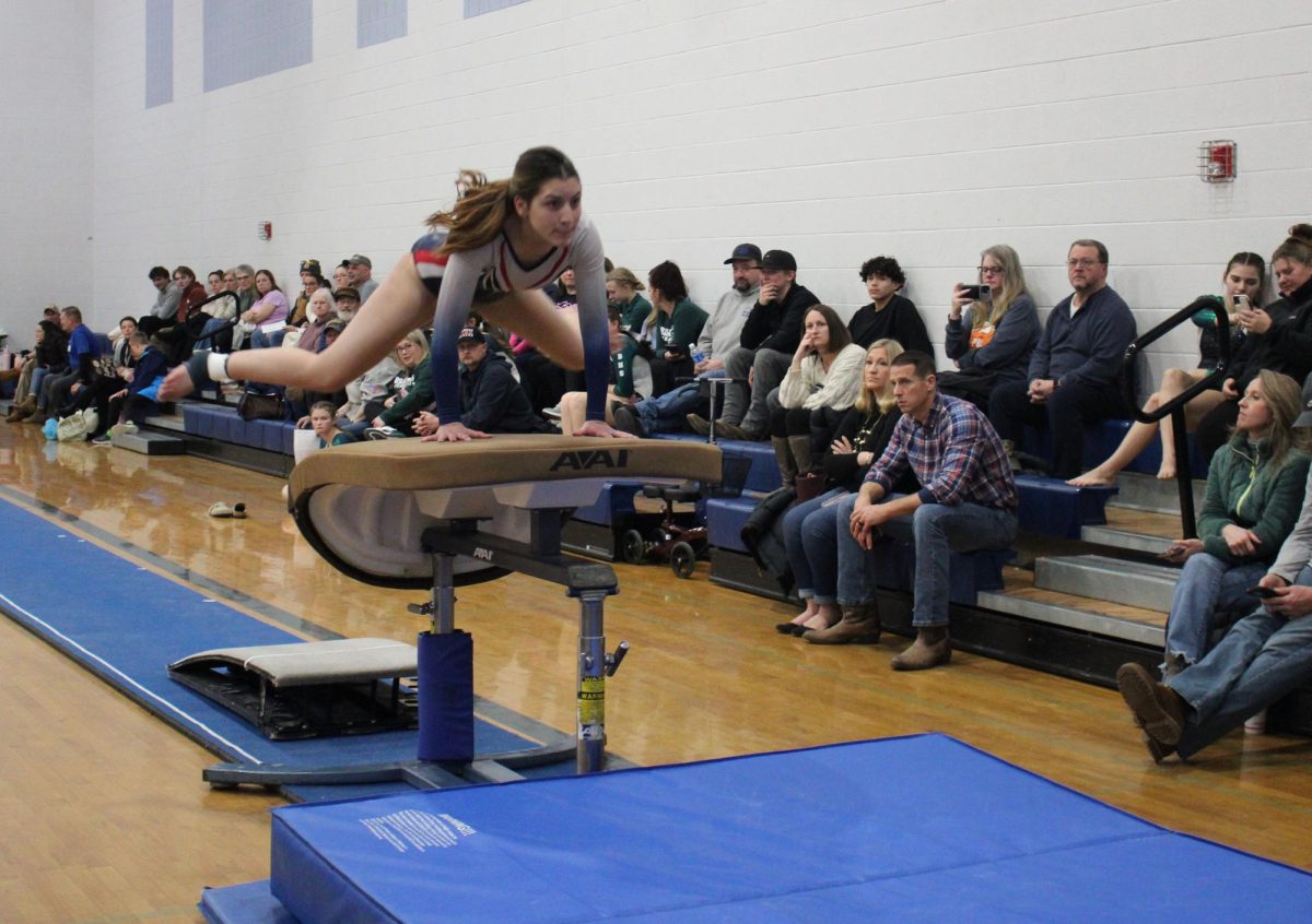 Senior Michelle Segarra does her vault routine.