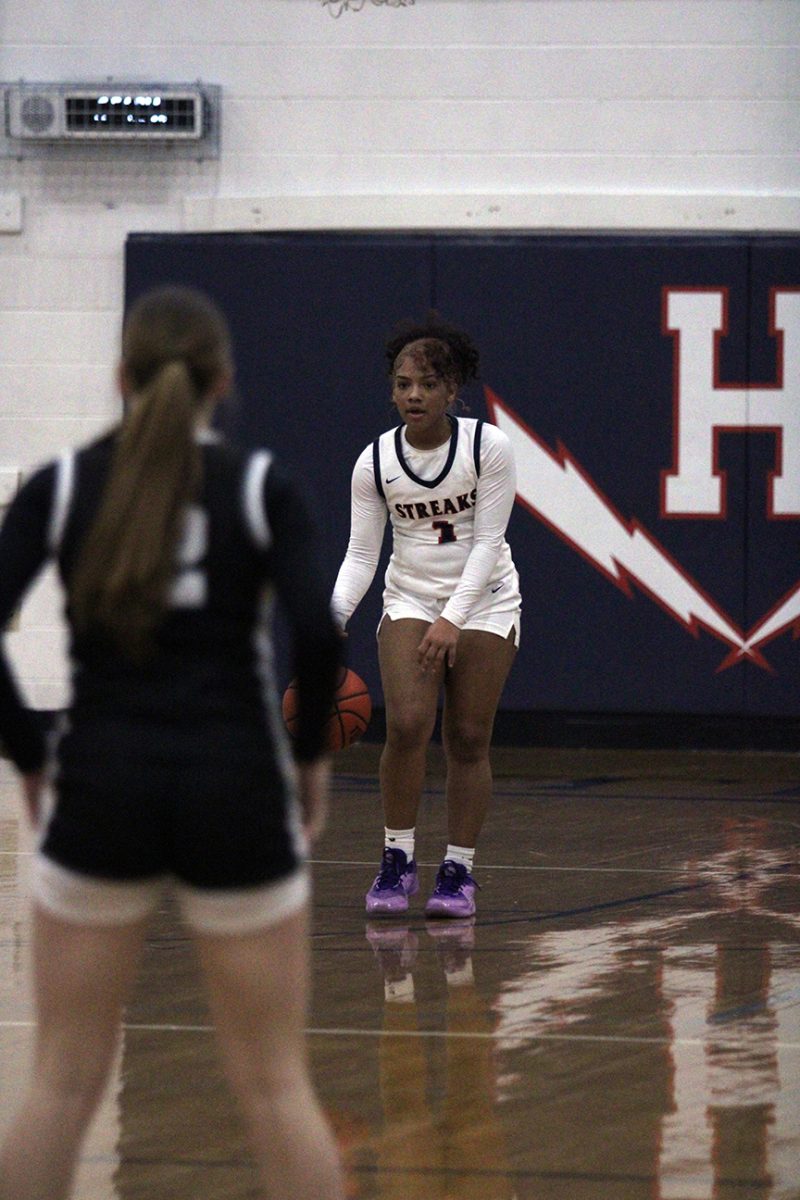 Sophomore Alyse Sheffey dribbles the ball down the court.