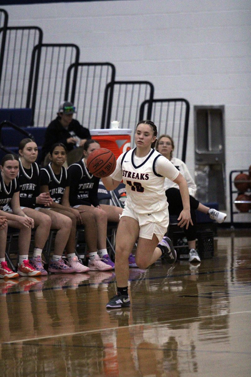 Junior Ah-Ghia Jones dribbles down the court. 