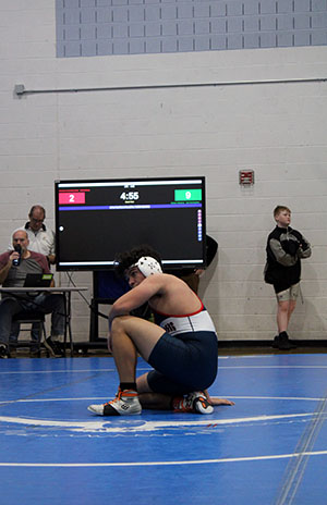 Freshman Enrique Hernandez Erazo taking a break on the mat.