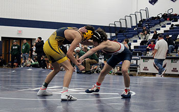 Freshman Mason George grabbing his opponents arm.