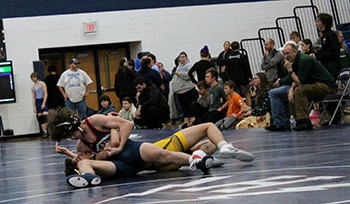 Freshman Mason George holding down his opponent.