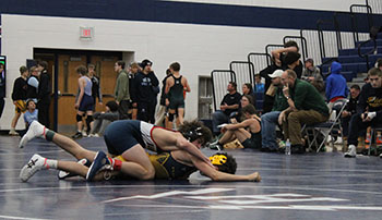 Freshman Mason George keeping his opponent down.