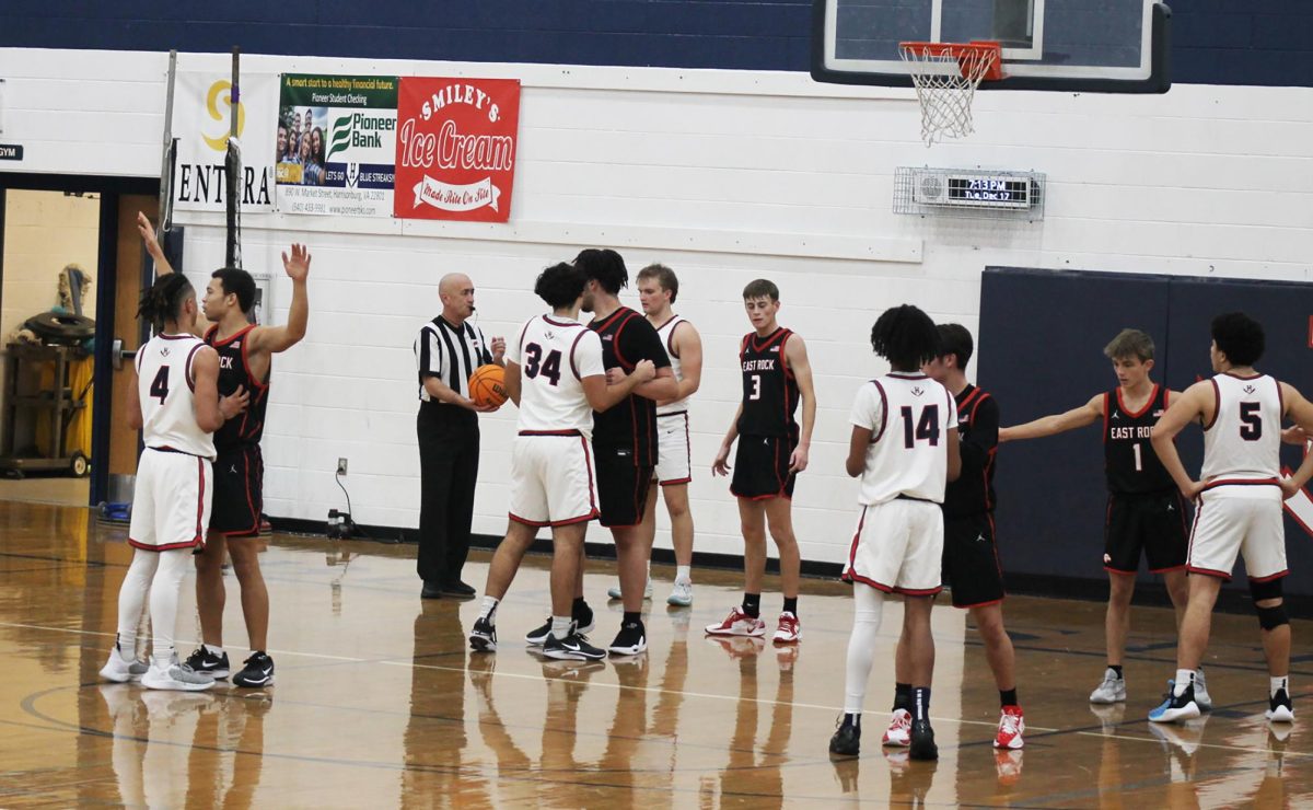 The varsity team gets into position to start the game.