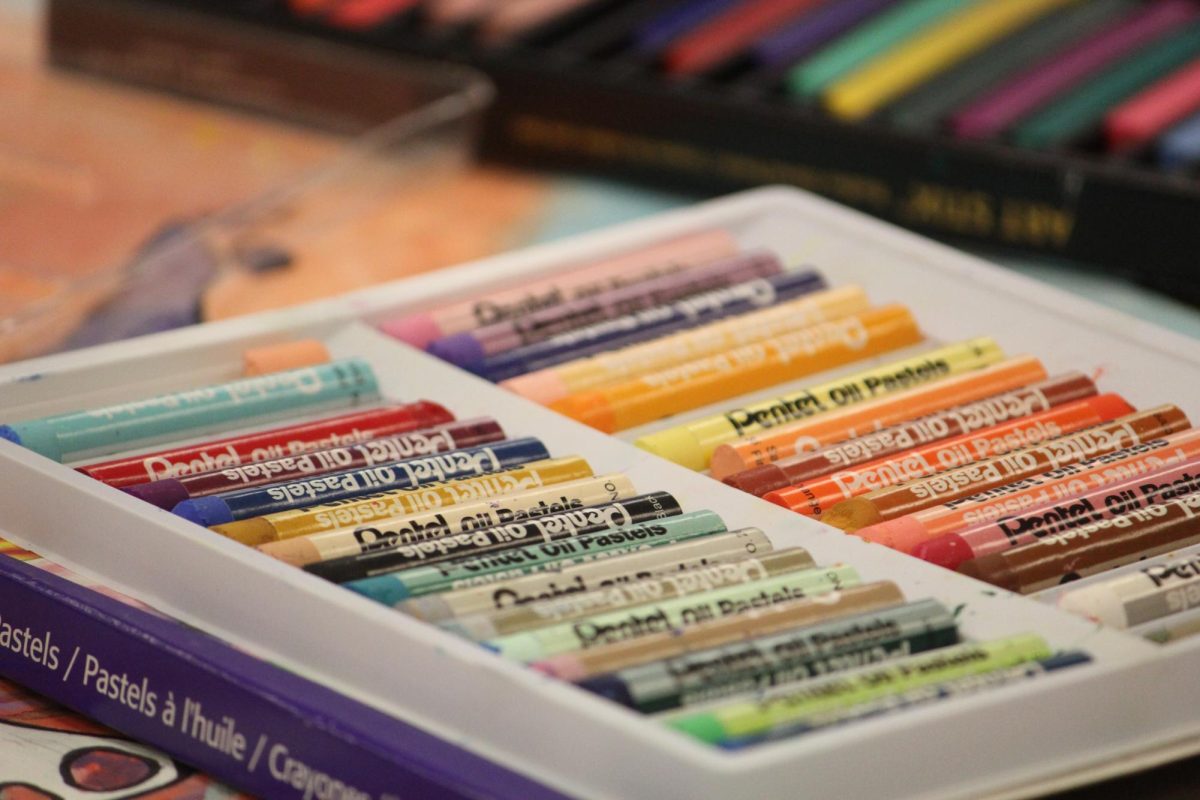 Oil pastels sit for use.