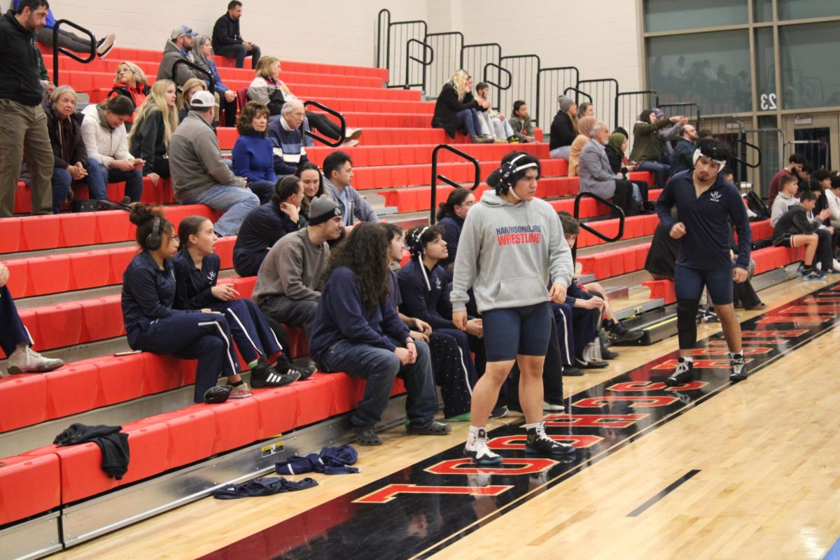 HHS team watches teammate compete