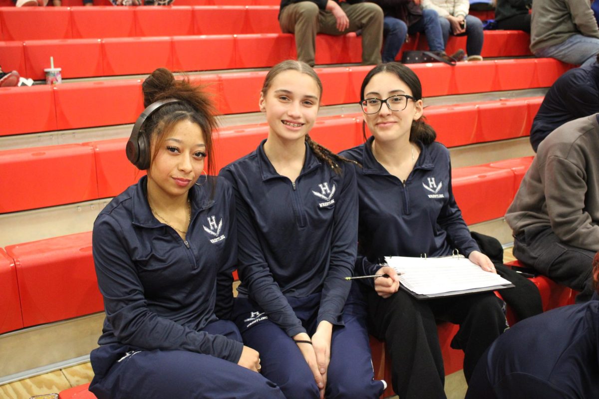 Team manager with two girl wrestlers from the HHS Wrestling team