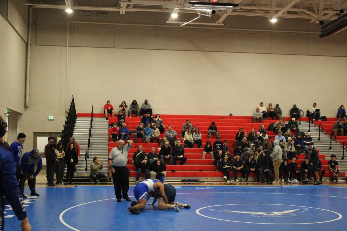 Students and family watch Wrestlers