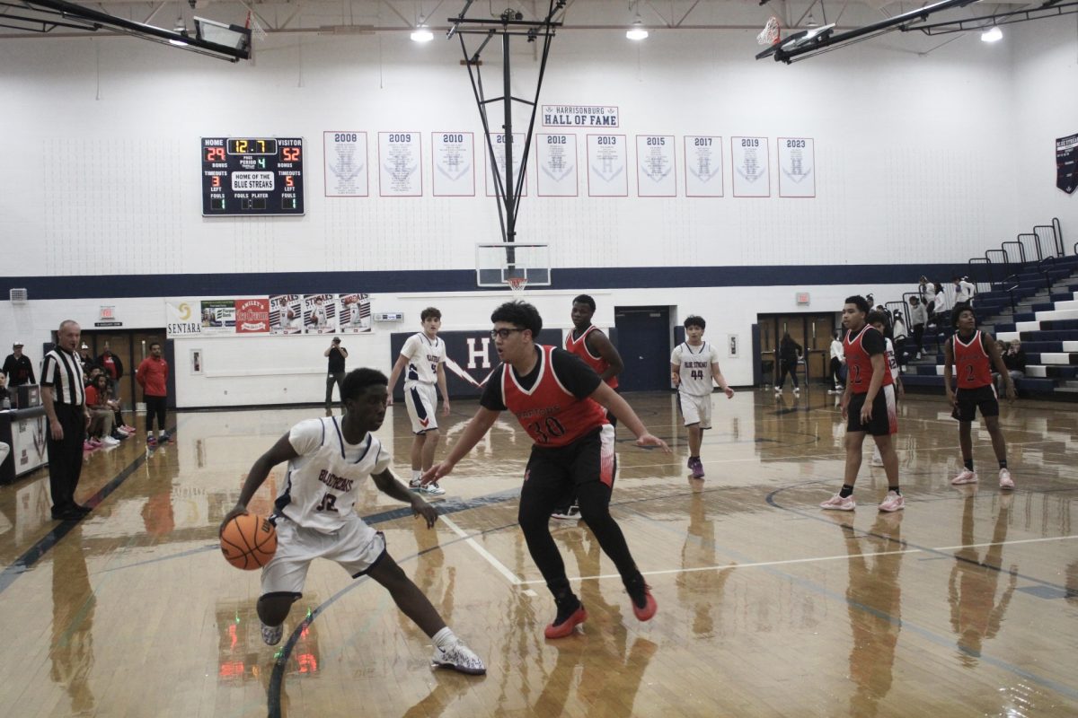 The Harrisonburg High School Basketball team show their great defense