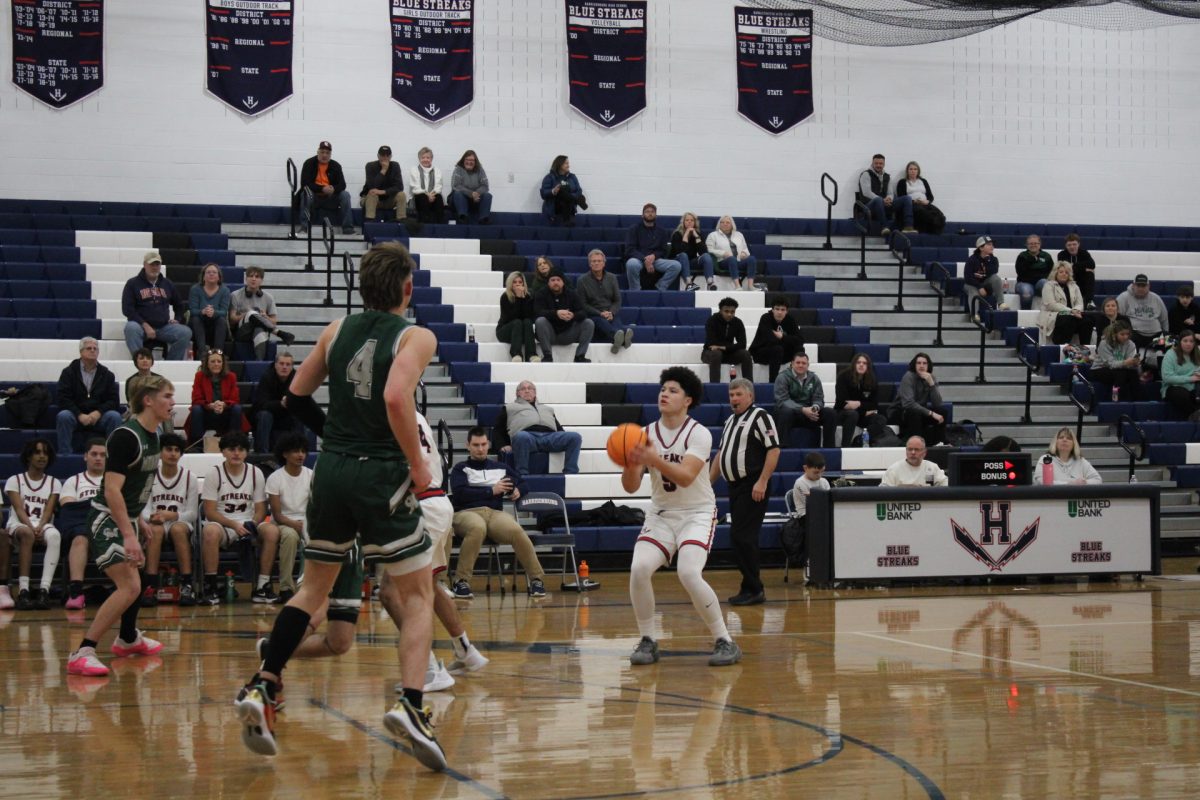 Yandel Robles takes advantage of the open space on the court. Robles decides to take a shot while the space is open