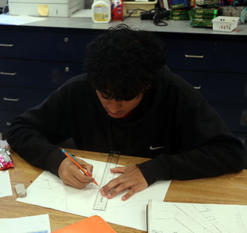 Robert Ayala sketches the beginnings of a project.