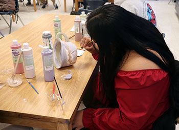 Ruth Valentin works on her "ugly mug."