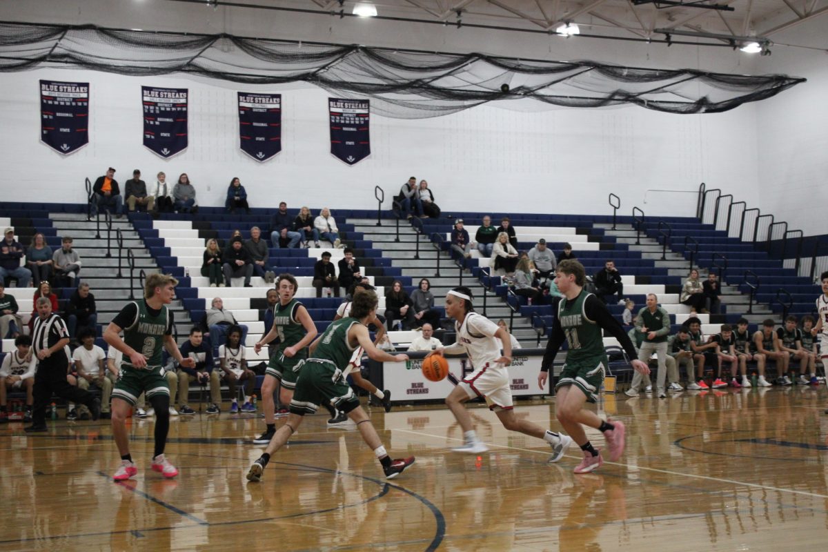 Lazaro Valdivia Arrillaga dribbles the ball towards one side of the court. Valdivia runs with speed and tries to dodge every other player to find an open space to take a shot.