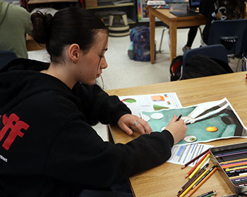 Vera Heller working with colored pencils.