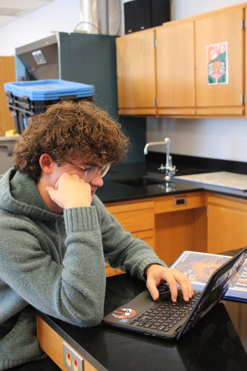 Davis Bert working on his lab report. 