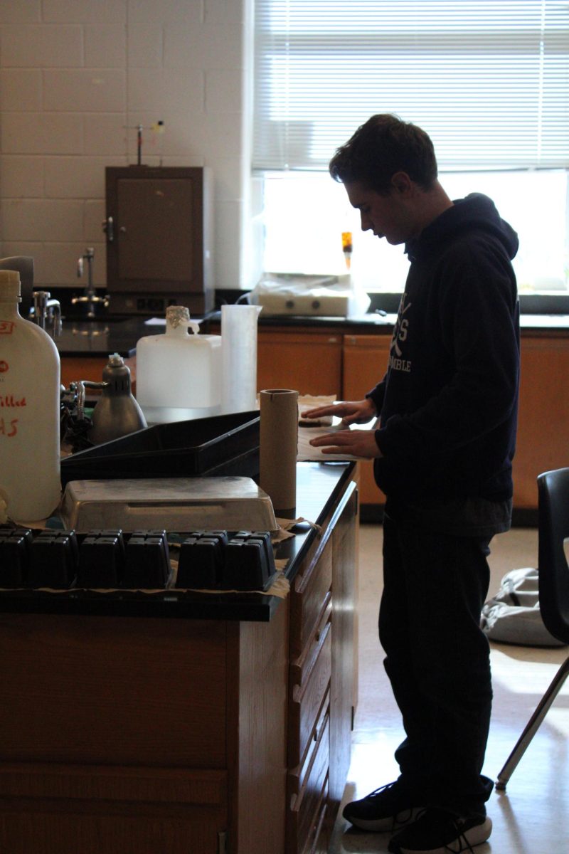 Joshua Nafziger grabbing something for his work. 