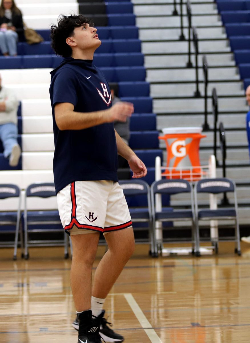 Senior Nick Santiago warming up before the game against Rockbridge.