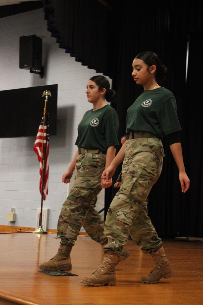 Amy Matamoros and Giselle Cano introduce the step team with salute.