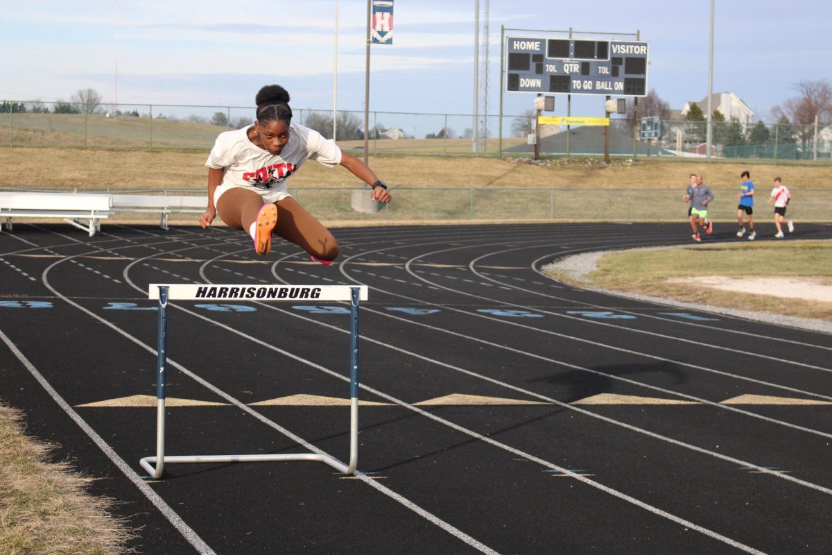 Junior Mariah Etienne practicing her hurdles for districts