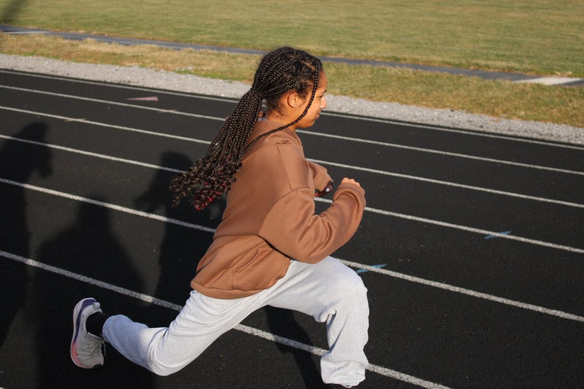 Freshman Gabrielle-Jackson stretching at track practice.