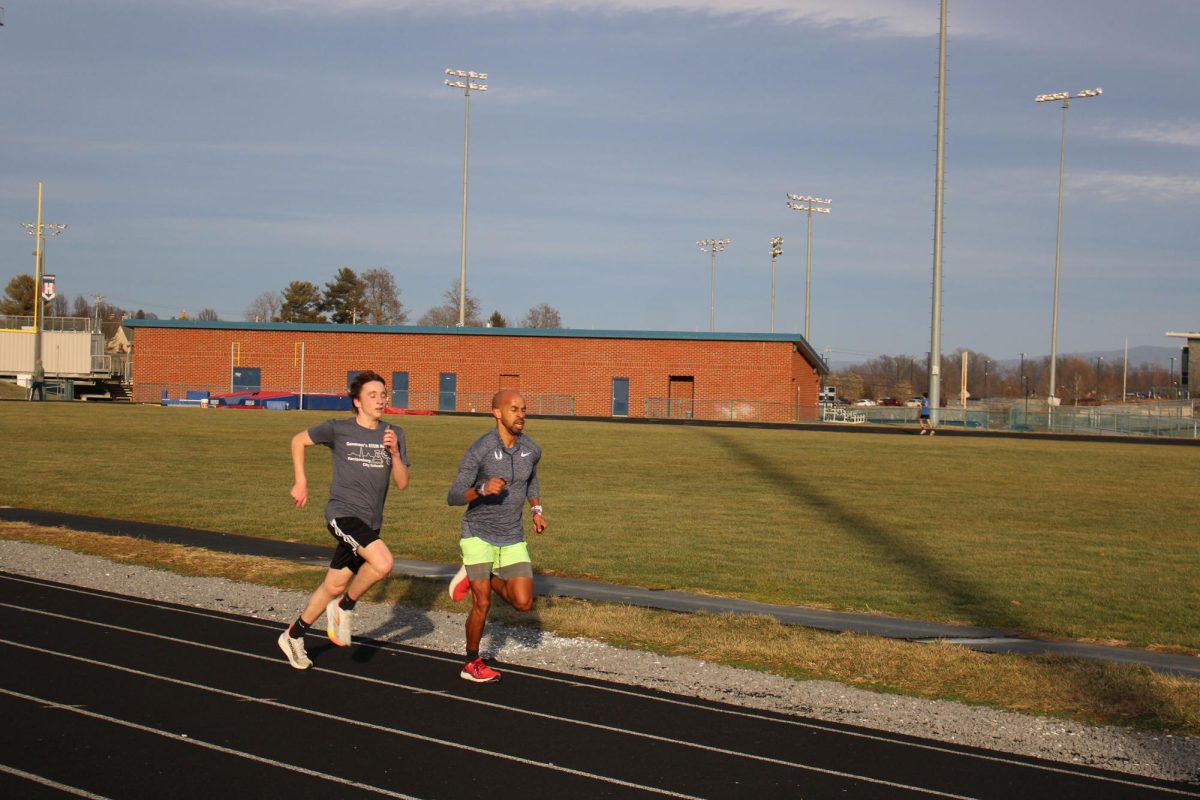 Coach peyton running laps at track practice.