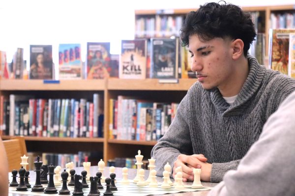 Students play chess during lunch