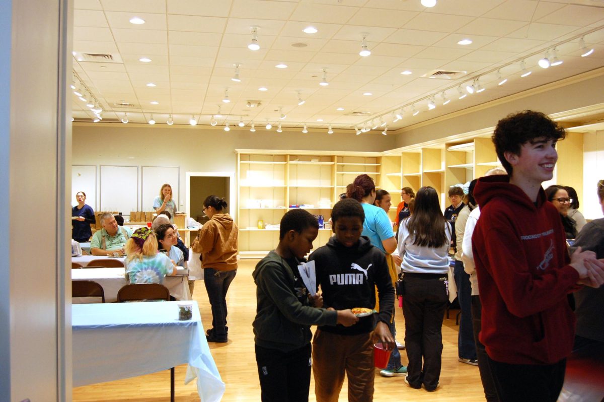 Volunteers seek refreshments in volunteer lounge.