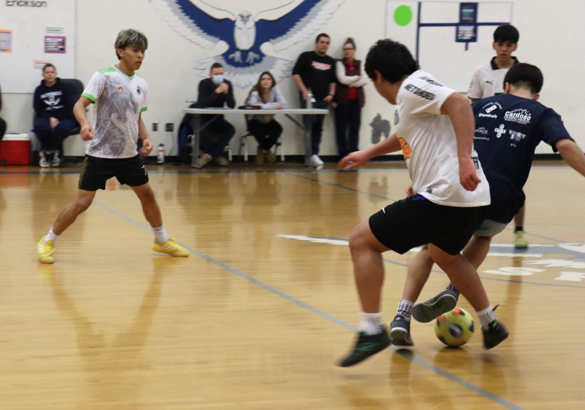 Senior Izzack Cruz Gonaglez gets thrown down trying to get the ball.