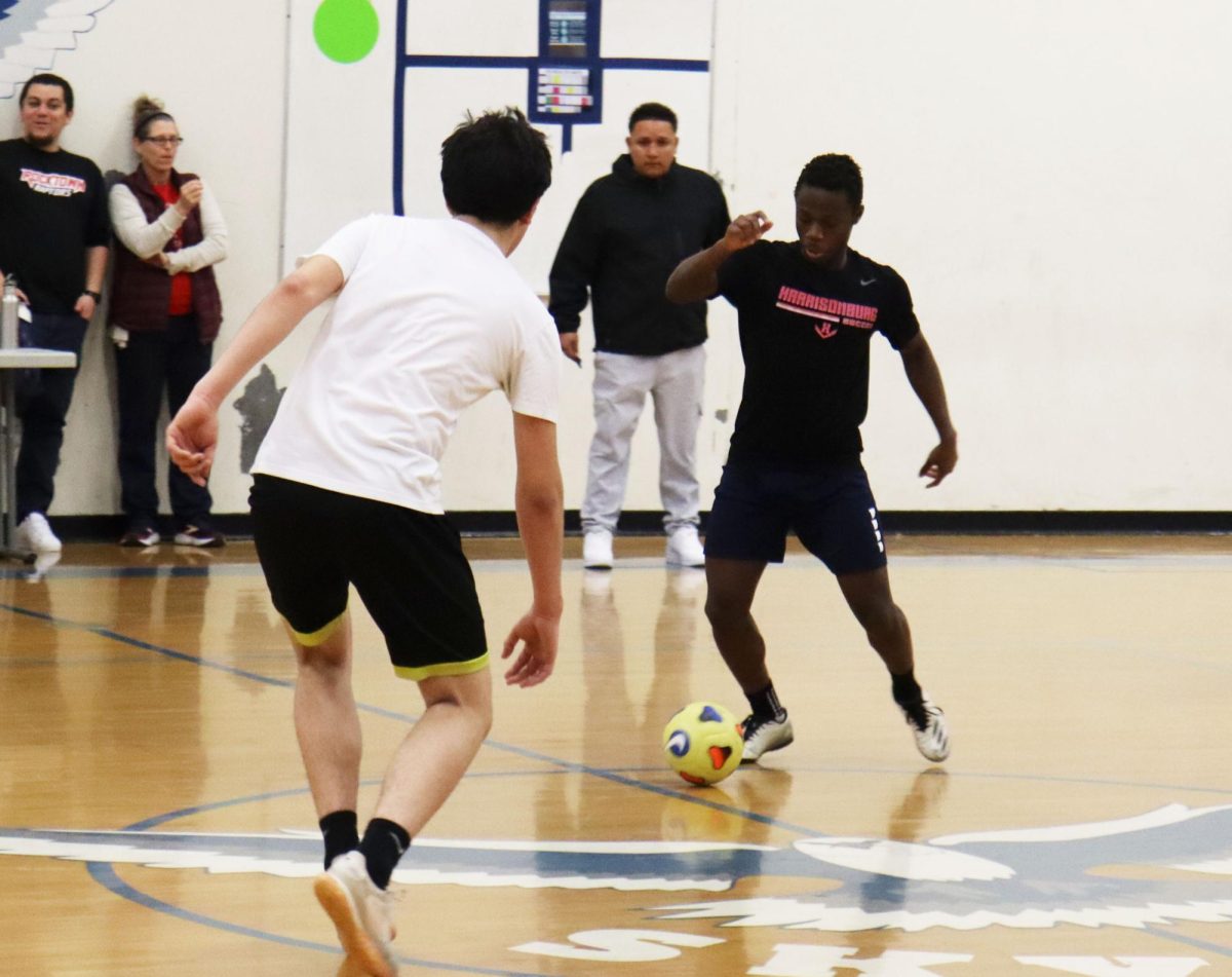 Senior Wilondja Baukyaka dribbles around a defender