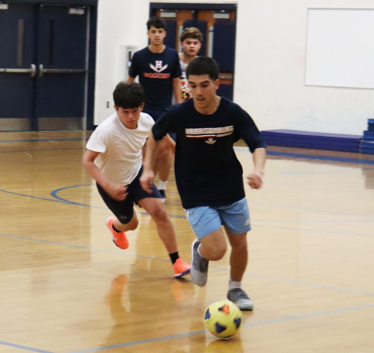 Senior Izzack Cruz Gonaglez dribbles around a defender.