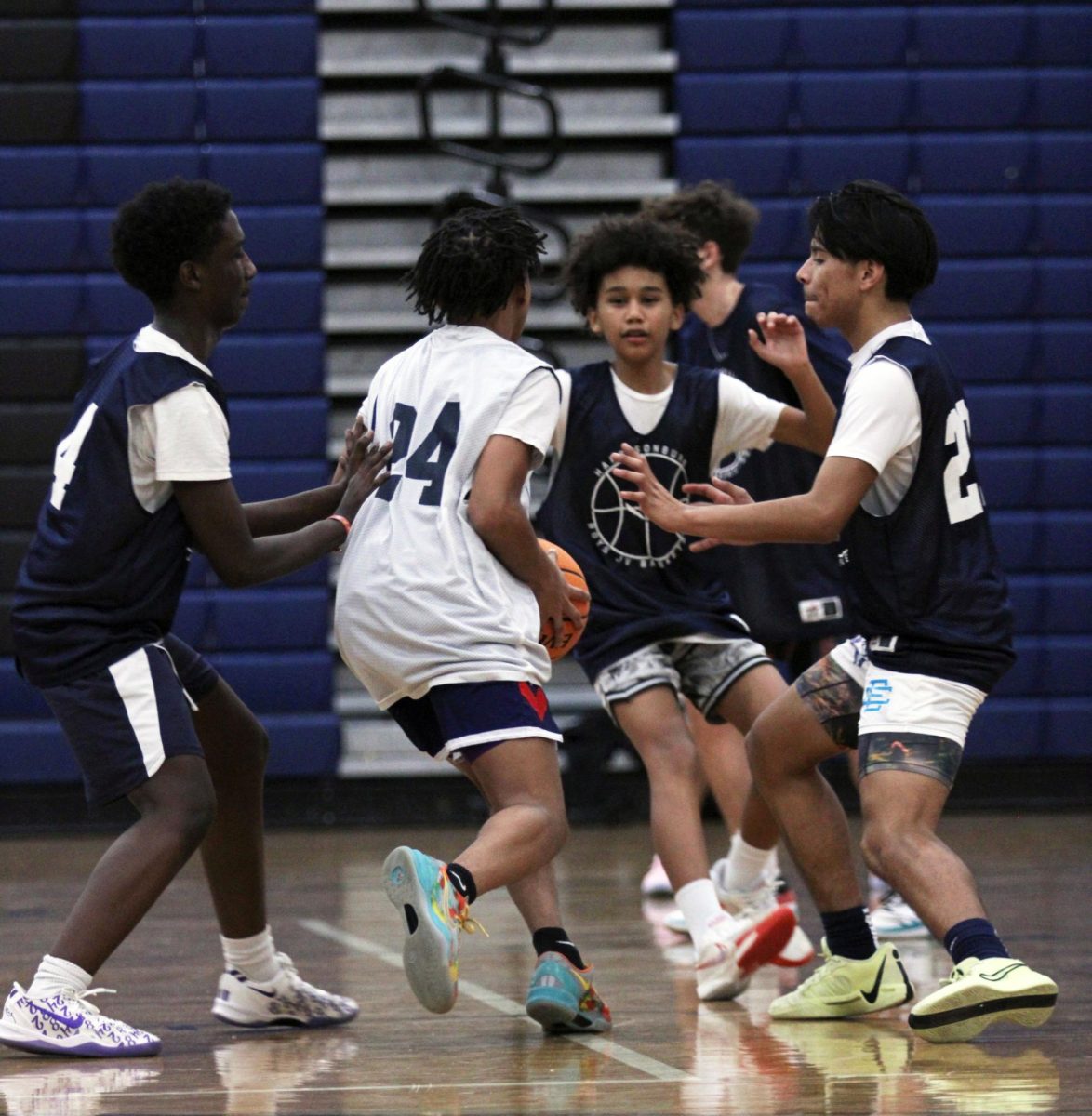 The JV Boys Basketball team is shown practicing before a game against William Monroe High School. Throughout these photos you can see these players hustling up and Down the court getting ready for their upcoming game. "One of the major things we spend some time on in practice are free throws because even if you miss just one, it can cost you the whole game", said John Lichti.  The Jv boys are working very hard as shown in the photos hoping to secure the victory in their upcoming game.#Bluestreakpride#HHSmediaLC